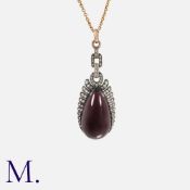 A French Antique Diamond And Garnet Pendant in 18k yellow gold and silver, comprising a series of