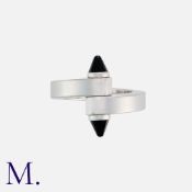 CARTIER. An Onyx Menotte Ring in 18K white gold, set with onyx cone terminations. Signed Cartier and