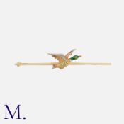 An Enamelled Duck Brooch in 15k gold and platinum, designed as a bar set with a three coloured metal