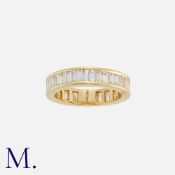 A Diamond Band Ring in 18K yellow gold set with baguette cut diamonds weighing approx. 2.5ct in