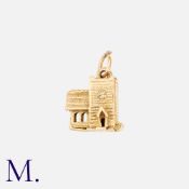 A Church Charm in 9ct yellow gold. Opens to reveal bride and groom. Size: 1.4cm Weight: 3.4g