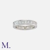 A Diamond Band Ring in 18K white gold set with princess cut diamonds weighing approx. 3.25ct in