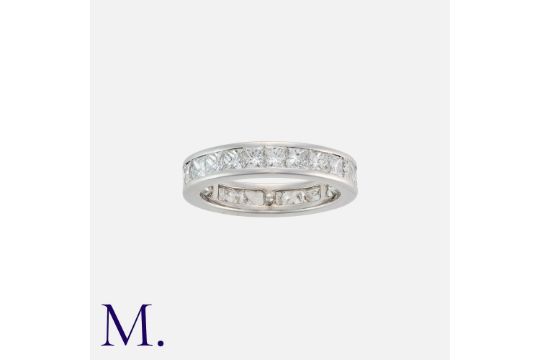 A Diamond Band Ring in 18K white gold set with princess cut diamonds weighing approx. 3.25ct in