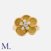 GIVENCHY. A Diamond Flower Ring in 18K yellow gold, with five overlapping petals and set to the