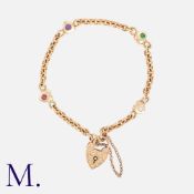 A 'D.E.A.R' Acrostic Heart Bracelet in 9k yellow gold, comprising a series of interlocking belcher