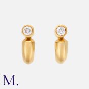 CARTIER. A Pair of Diamond Earclips in 18k yellow gold, of half hoop form, each set with a round cut