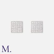 A Pair Of Diamond Stud Earrings in 18k white gold, of square design each set with five rows of round