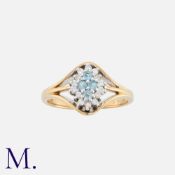 An Aquamarine and Diamond Ring in 9K gold, set with four round cut aquamarines to the centre with