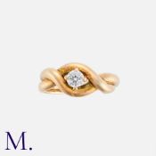 A Diamond Ring in 9K yellow gold, with cross-over style, set with a round cut diamond weighing