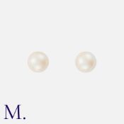 A Pair of Pearl Studs each set with a pearl (approx. 0.7mm diameter) with yellow gold studs and