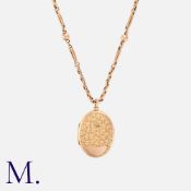 An Antique Gold Locket And Chain in 9k yellow gold, the foliate and scrolling engraved locket
