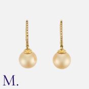 A Pair Of Pearl And Diamond Earrings in 18k yellow gold, the diamond set, hoop shaped tops