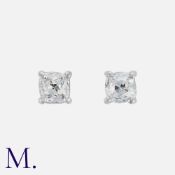 A Pair Of Old Cut Diamond Stud Earrings, in white gold each set with an old cut diamond of