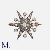 An Antique Diamond Star Brooch in silver and yellow gold set with old cut and rose cut diamonds, the