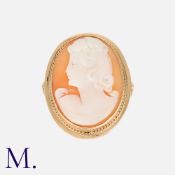 A Cameo Ring in 9k yellow gold, set with a shell cameo depicting a woman in profile. Unmarked but