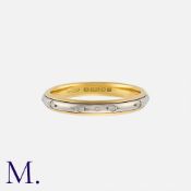 A Diamond Band in 18K yellow and white gold, set with round cut diamonds weighing approx. 0.10ct