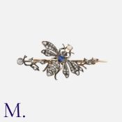 An Antique Sapphire, Diamond and Pearl Bee Brooch in yellow gold and silver, set with a cushion-