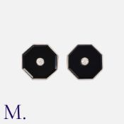 A Pair of Art Deco Onyx and Diamond Earrings in 18K gold and platinum. Set to the centre with old