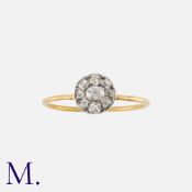 A Diamond Cluster Ring in yellow gold and silver, comprising a cluster of old cut diamonds totalling