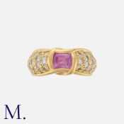 CHAUMET. A Pink Sapphire and Diamond Ring in 18K yellow gold, set with a cushion cut pink sapphire