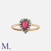 A Spinel And Diamond Ring in yellow gold and silver, set with a heart shaped spinel of approximately