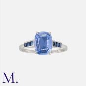 A Sapphire Ring in platinum, set with a cushion shaped sapphire of approximately 1.86cts, accented