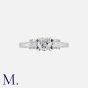 A Diamond Three Stone Ring in platinum, comprising three round cut diamonds, the principal stone