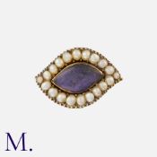 An Antique Lovers Eye Brooch in yellow metal, the eye shaped brooch with a glass centre in a