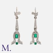 A Pair Of Emerald And Diamond Earrings in white gold, the articulated drops set with rose cut