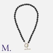 NO RESERVE. TIFFANY & CO. An Onyx Toggle Necklace in silver, with onyx beads terminating in a silver