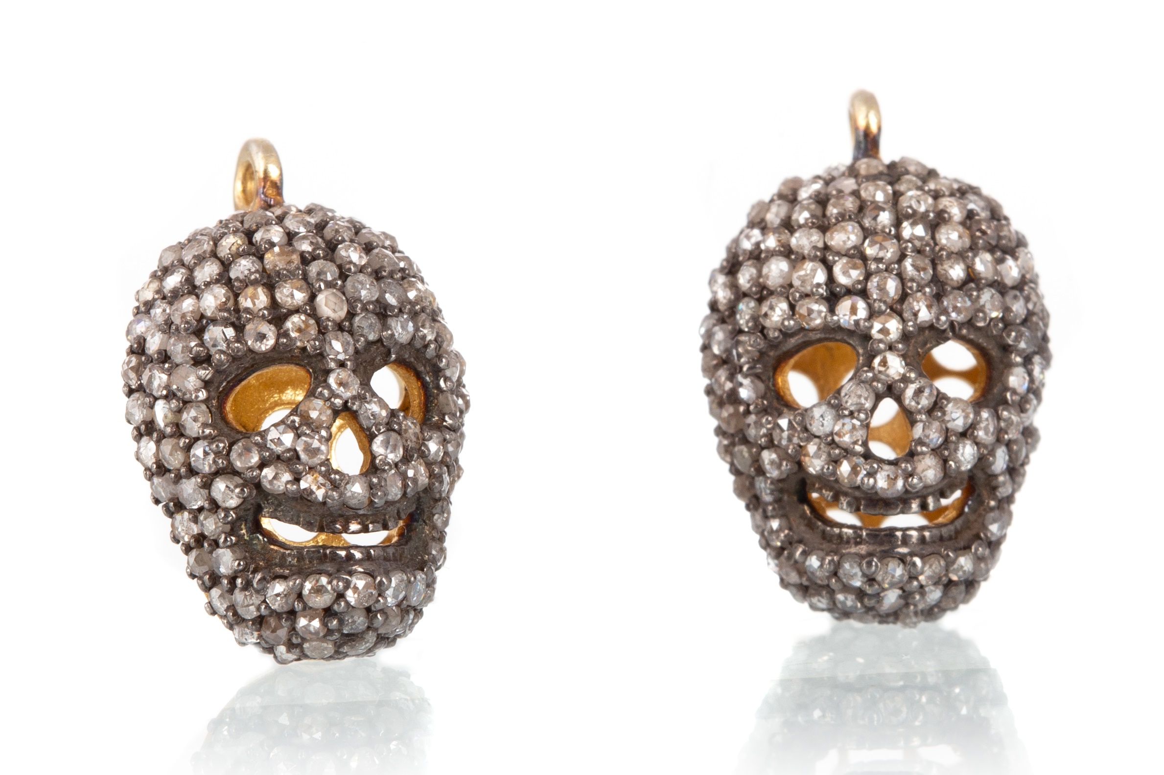 PAIR OF DIAMOND SKULL PENDANTS,