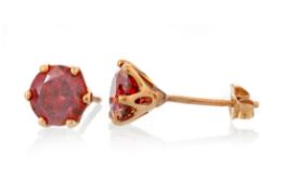 PAIR OF TREATED RED DIAMOND STUD EARRINGS,