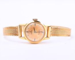 14 kt yellow gold Omega wind-up ladies watch with Milanese strap