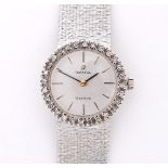 18 carat white gold Omega ladies wristwatch, solid closed strap. Gray dial
