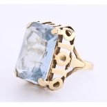 14 kt yellow gold openwork statement ring set with 1 emerald cut syn. topaz. Weight 7.4 gr