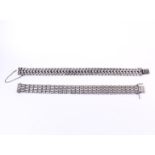 Two silver women's fantasy flat link bracelets, with a sliding clasp and safety chain