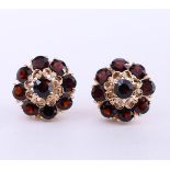 14kt rose gold rosette earrings set with old European cut garnet