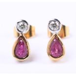 18 carat bicolor stud earrings, each set with an oval cut ruby and brilliant cut diamond