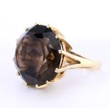 14 kt yellow gold solitaire ring set with large brilliant cut smoky quartz