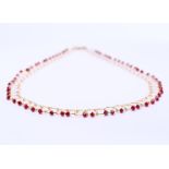 14 kt yellow gold wire necklace set with red crystal stones. Necklace length 41cm