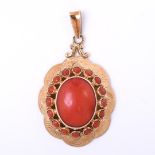 9 carat yellow gold ladies pendant, set in the center with a cabuchon cut red coral