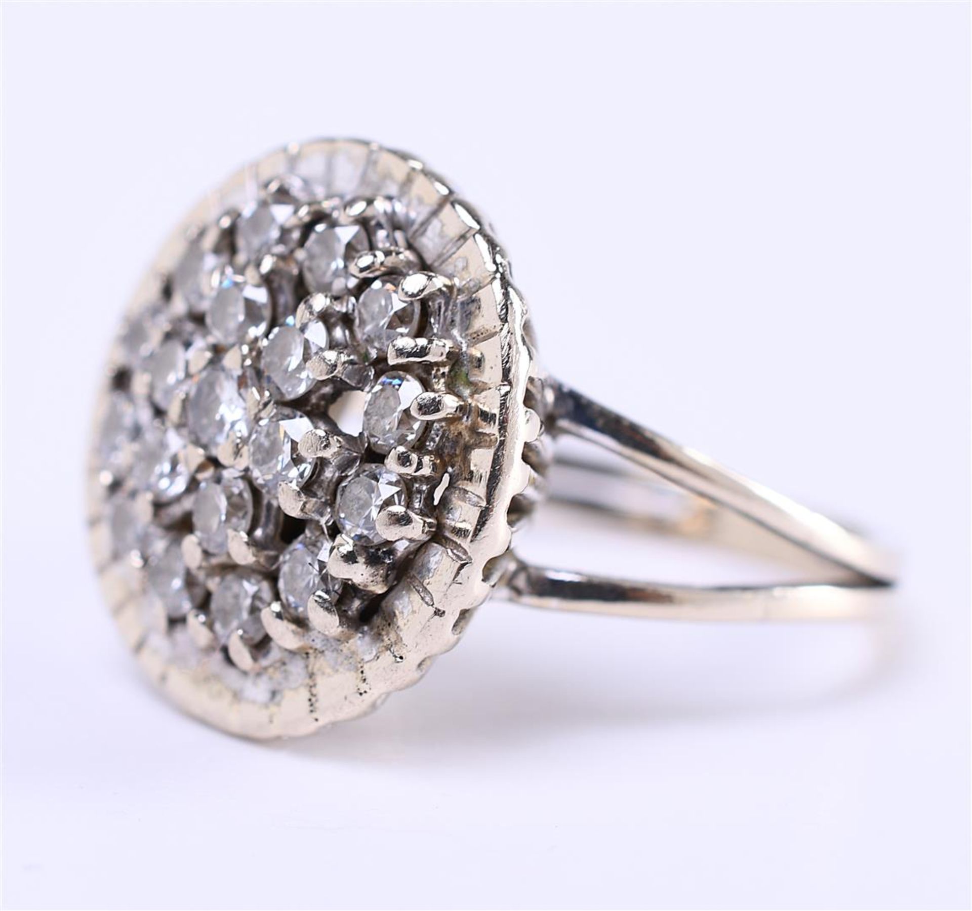 14 carat white gold cluster ring set with approximately 19 brilliant cut diamonds