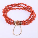 14 kt red coral women's bracelet, with 3 strands of partly knotted red coral on trenches
