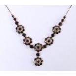 14kt rose gold necklace set with old European cut garnet. Of which 7 are of 0.50ct