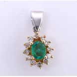 14 kt bicolor gold entourage pendant set with diamond and emerald