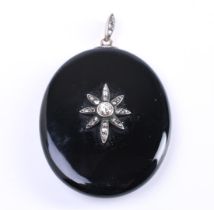 Medallion pendant onyx stone oval set with approximately 19 rose cut rough diamonds