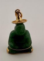 18 kt yellow gold pendant with jade Buddha. Hallmarks not present