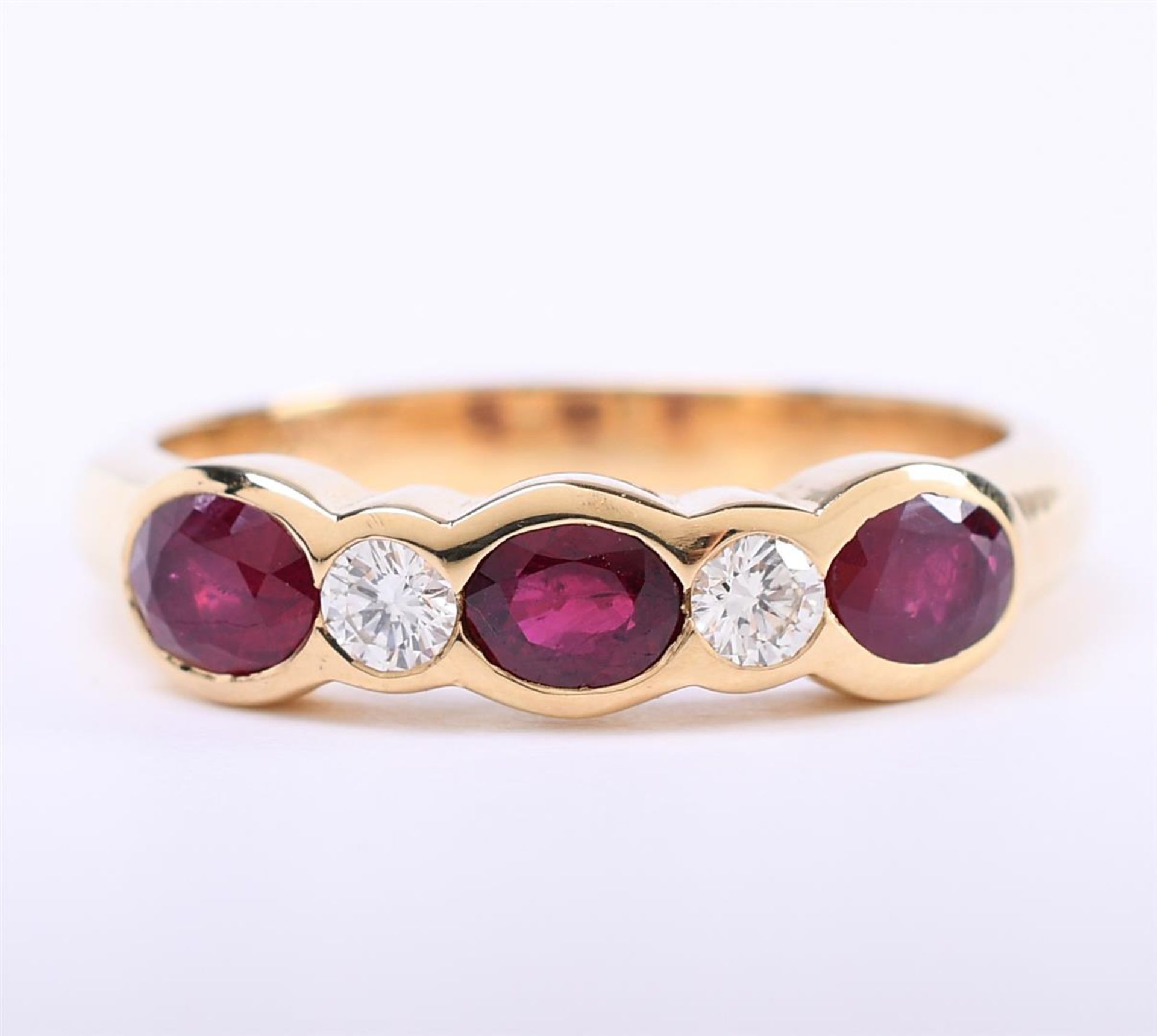 18 carat yellow gold ladies ring set with approximately 3 x oval cut rubies