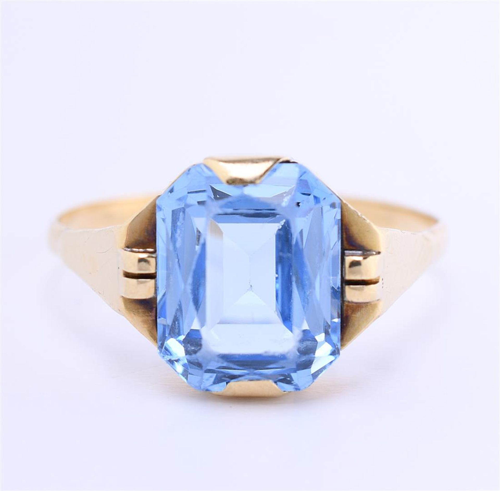 14 kt yellow gold solitaire ring set with emerald cut imitation aquamarine