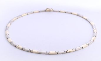 14 kt bicolor gold necklace, matte top, shiny bottom. With sliding closure